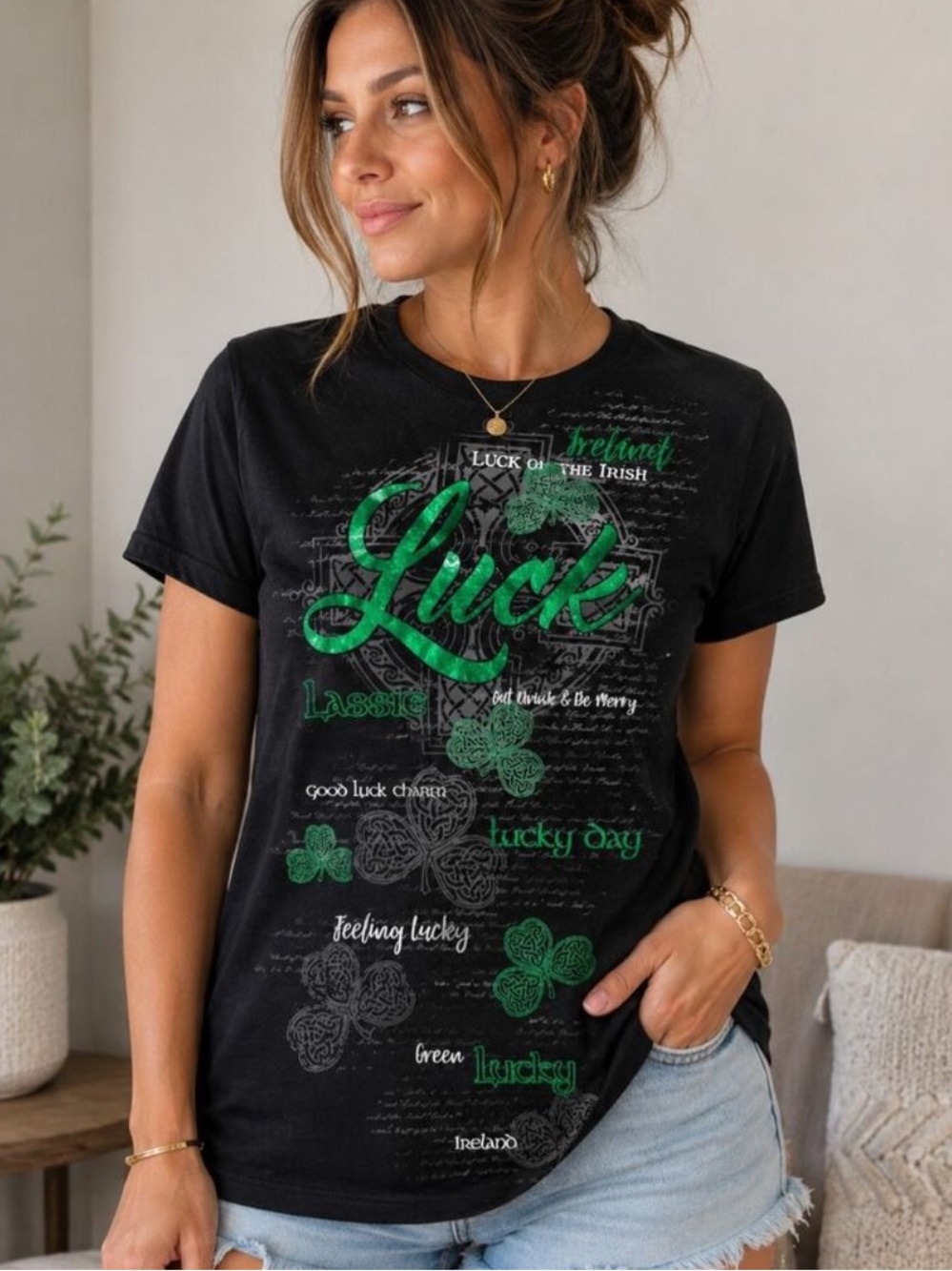 Black Graphic Tee with Green Shamrock Detail woman’s size large